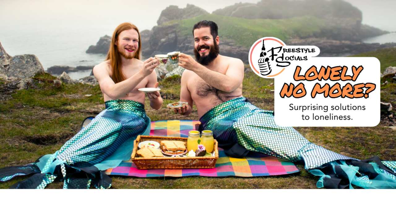 two mermen with beards having a picnic